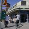 People walks in and out of a bodega in the Bronx section of New York, Friday, July 22, 2022. 