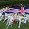 Flowers are seen laid outside the British Embassy in Washington, Friday morning, Sept. 9, 2022. 