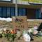 Elijah Newcomb of Colorado Springs lays flowers near a gay nightclub in Colorado Springs, Colo., Sunday, Nov. 20, 2022 where a shooting occurred late Saturday night.