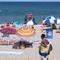 Beachgoers enjoy a sunny day on the beach in Point Pleasant Beach, N.J. on July 15, 2019.