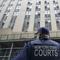 A New York State court officer stands guard outside the District Attorney's office, Wednesday, March 22, 2023, in New York.