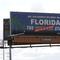 A new billboard welcoming visitors to 'Florida: The Sunshine 'Don't Say Gay or Trans' State. is seen Thursday, April 21, 2022, in Orlando, Fla.