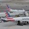 American Airlines planes sit on the tarmac at Terminal B at LaGuardia Airport, Jan. 11, 2023, in New York. 