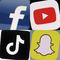 This combo photo shows the logos of Facebook, top left; YouTube, top right; TikTok, bottom left; and Snapchat, bottom right, on mobile devices. 