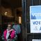 'Vote' signs are seen near an early voting site on October 25, 2025 in the Flatbush neighborhood of the Brooklyn borough in New York City. 