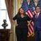 U.S. Rep. Adelita Grijalva (D-AZ) and Speaker of the House Mike Johnson (R-LA) speak to the media during a ceremonial swearing-in at the U.S. Capitol Building on November 12, 2025 in Washington, DC.