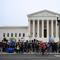 Members of the National TPS Alliance rally at the US Supreme Court in Washington, DC, on April 29, 2026. The Supreme Court is examining the revocation of Temporary Protected Status (TPS) for Haitian a