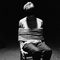 tied to a chair, bound, gagged