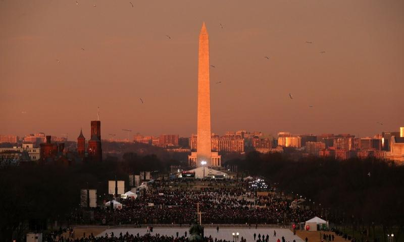 Birds fly over the mall in the early morning in front of the Washington Monument before the presidential inauguration at the U.S. Capitol on January 21, 2013 in Washington, D.C.