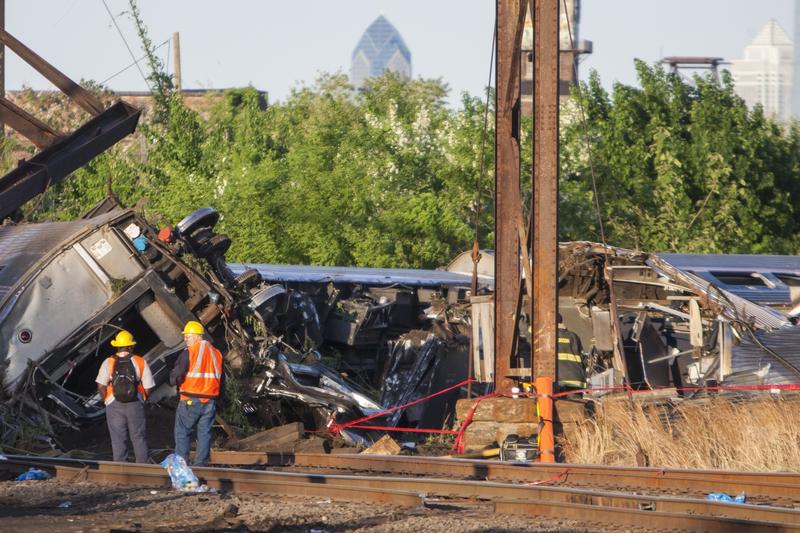 Rescue crews and investigators inspect the site of an Amtrak train derailment in Philadelphia on May 13, 2015. 