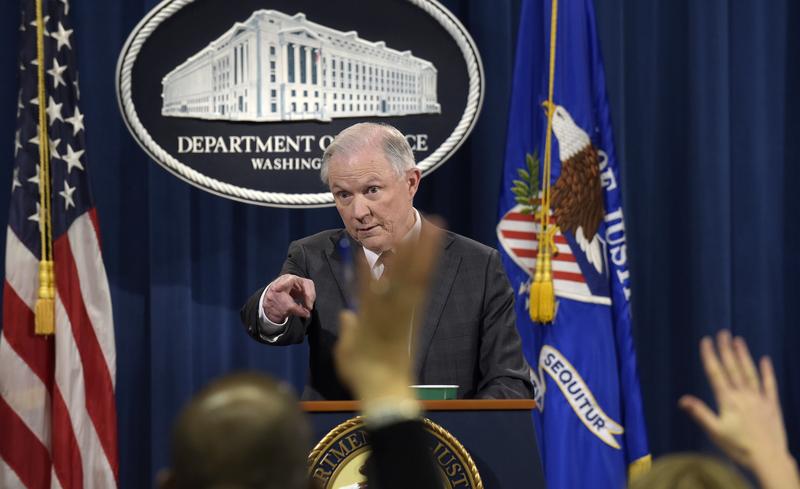 Attorney General Jeff Sessions calls on a reporter during a news conference at the Justice Department in Washington, Thursday, March 2, 2017. 