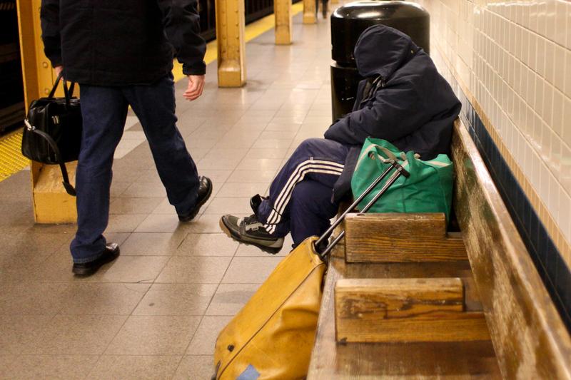 Homeless woman in Lower Manhattan subway station.