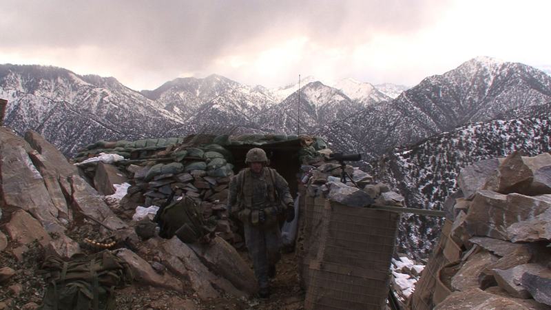 SFC Patterson checking his men at OP, in "Korengal," a documentary directed by Sebastian Junger