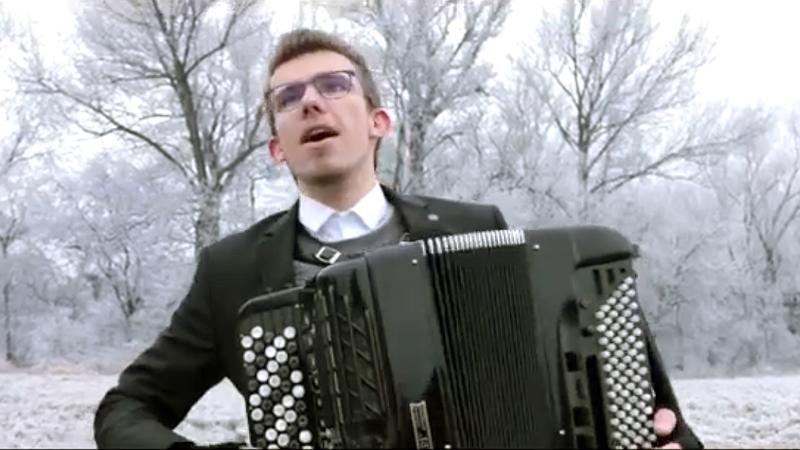 Milan Řehák plays the accordion in a special outdoors performance of 'Winter.'