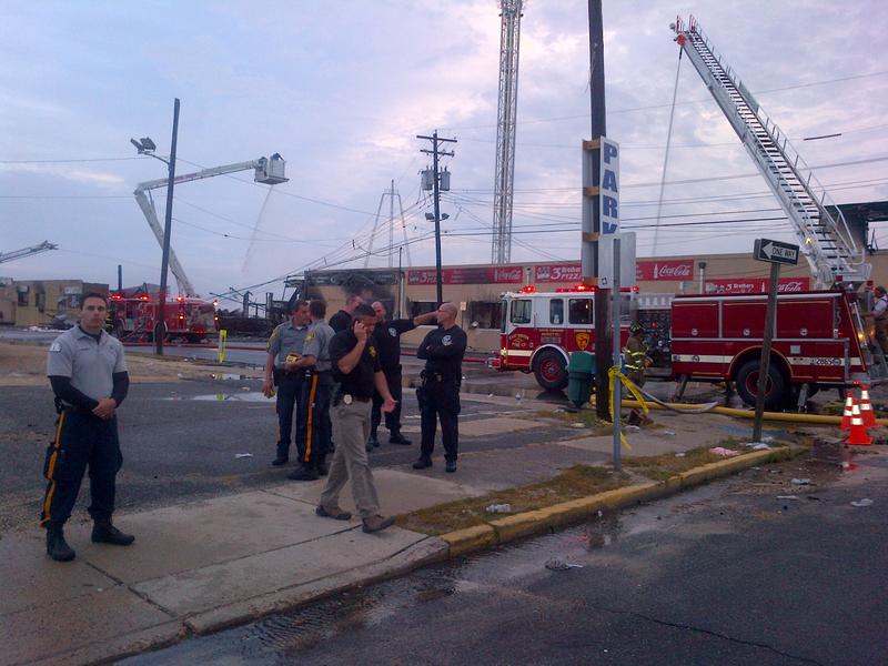 Firefighters survey the scene at the boardwalk fire in Seaside Park, NJ.