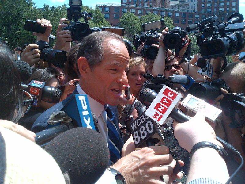 Reporters swarm former Governor Eilot Spitzer as he tries to collect petition signatures for his late entry into the city comptroller race. 