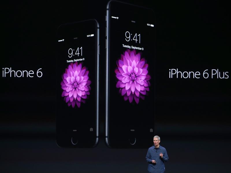 Apple CEO Tim Cook announces the iPhone 6 and iPhone 6 Plus at the Flint Center in Cupertino, Calif., Tuesday.