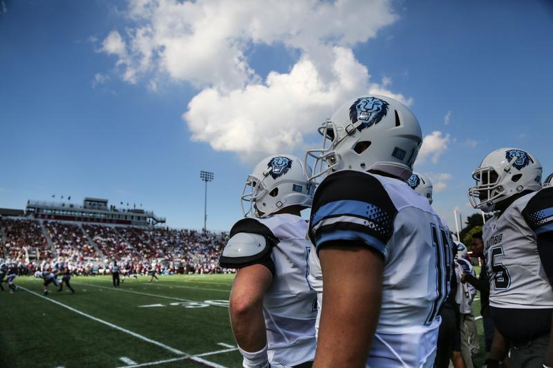 Columbia football players stand on the sideline of Fordham's Jack Coffey Field during Saturday's game against the Rams.