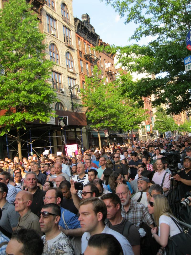 Crowd marching through the West Village to denounce death of Mark Carson. They chanted, among other things "They say get out. We say come out."