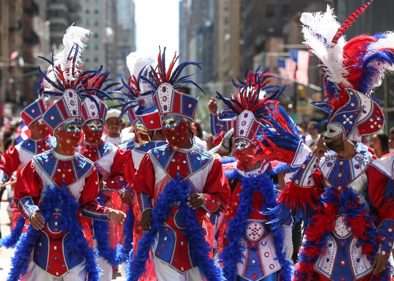  Attendees perform at the Dominican Day Parade in New York City on August 10, 2015, a month after the Dominican government expelled thousands of people of Haitian descent from the Dominican Republic.