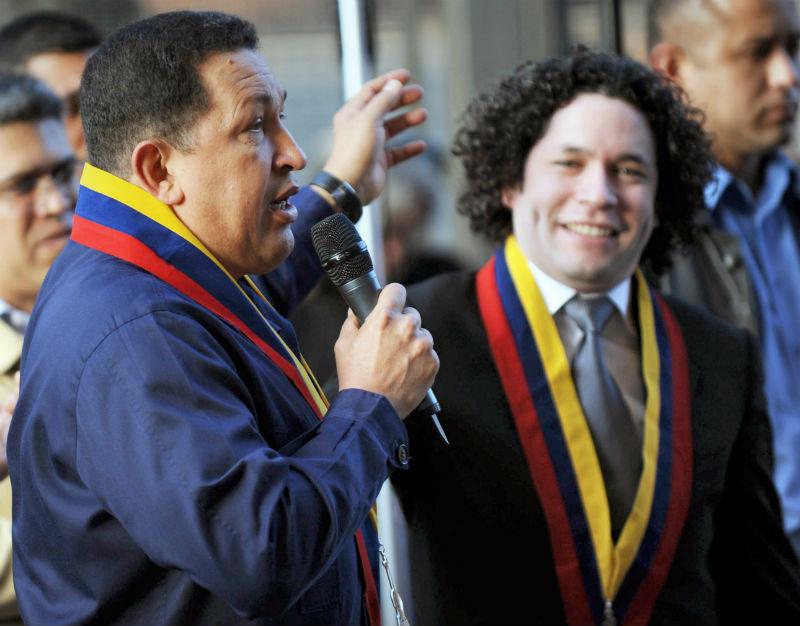 Hugo Chavez (L) speaks next to Gustavo Dudamel (R) in Caracas on Feb. 12, 2011