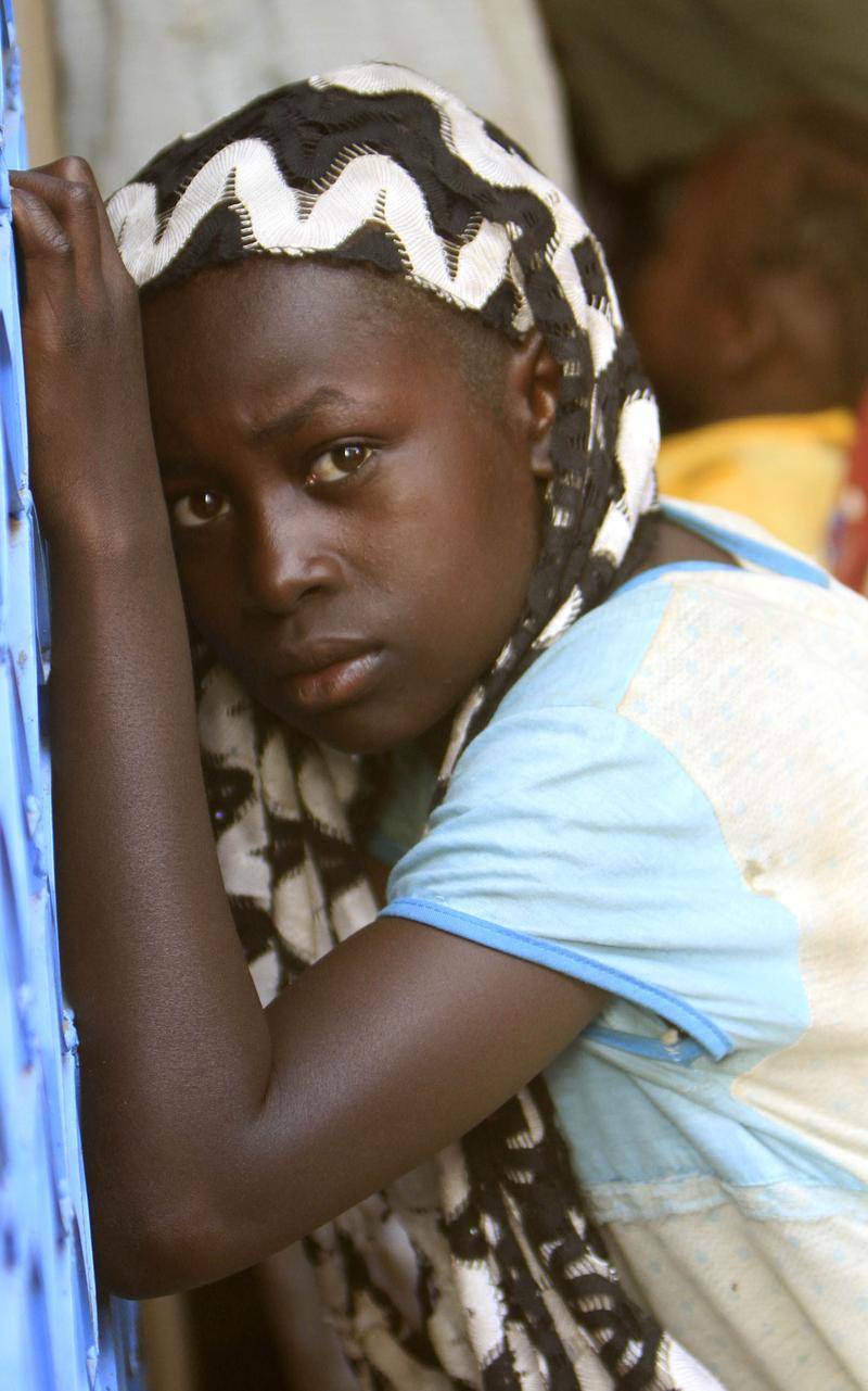 A refugee woman is seen at the refugee camp for the internally displaced in Kalma, home to 80,000 people on the outskirts of Nyala, the capital of South Darfur state on November 8, 2010. 