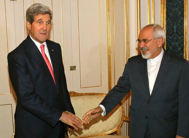 US Secretary of State John Kerry (L) and Iranian Foreign Minister Mohammad Javad Zarif shake hands prior to a bilateral meeting of the closed-door nuclear talks with Iran in Vienna.