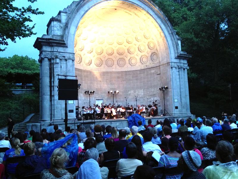 The Orpheus Chamber Orchestra resumes its concert on July 9, 2013, at the Naumburg Bandshell in Central Park following a rain shower.