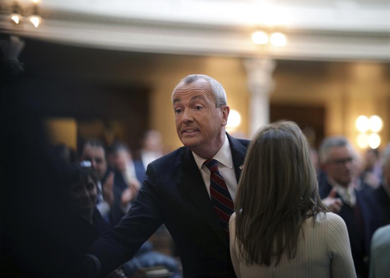 New Jersey Gov. Phil Murphy greets audience members Tuesday, March 13, 2018, in the Assembly chamber of the Statehouse in Trenton, N.J., where he unveiled his 2019 budget.