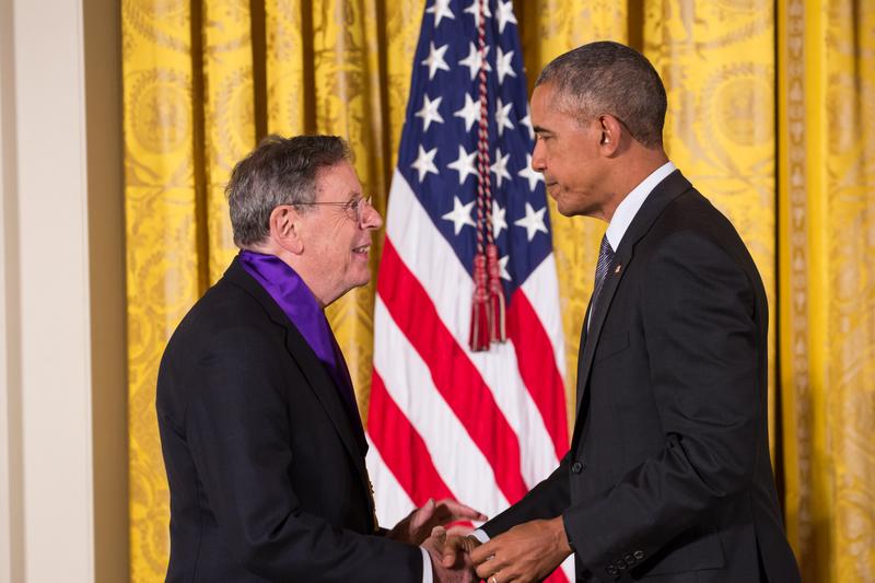 Philip Glass receiving a 2015 National Medal of Arts from President Barack Obama
