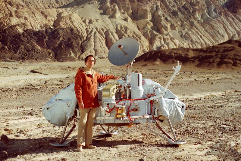 Carl Sagan, host of the original "Cosmos," with a model of the Viking lander.