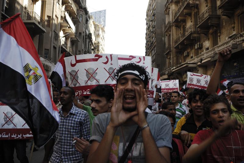  Unidentified anti-Muslim Brotherhood/Morsi protesters in Tahrir Square shout slogans calling for Morsi's resignation on June 30, 2013 in Cairo, Egypt.