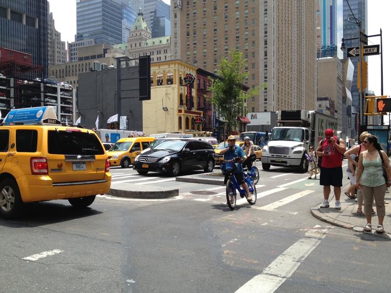 Taxis, pedestrians, and Citi Bikers: the usual Manhattan street melange.