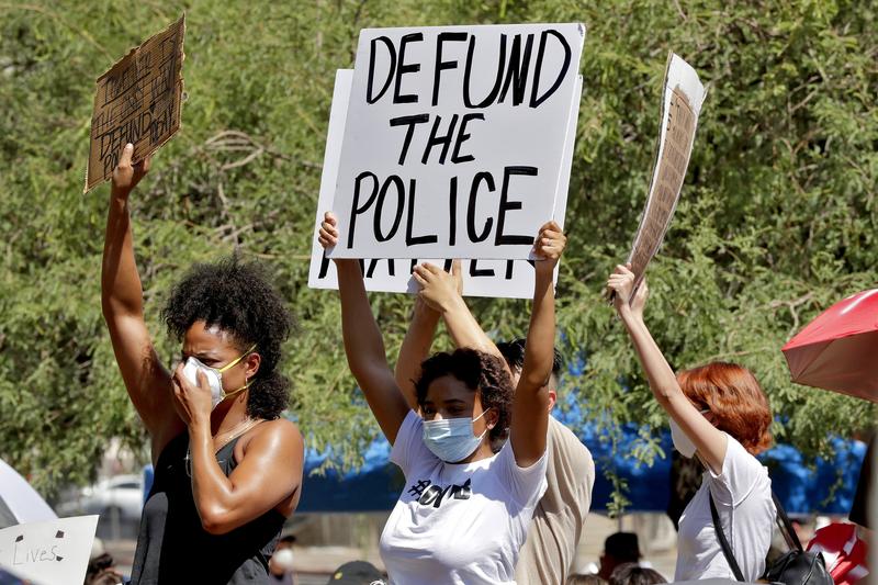 Protesters rally Wednesday, June 3, 2020, in Phoenix, demanding the Phoenix City Council defund the Phoenix Police Department. 