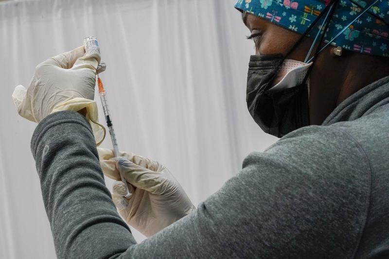 In this April 8, 2021, file photo, a Northwell Health registered nurse fills a syringe with the Johnson & Johnson COVID-19 vaccine at a pop up vaccination site inside the Albanian Islamic Cultural Cen