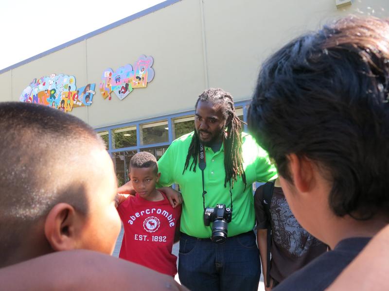 Ashanti Branch, an assistant principal at Montera Middle School in Oakland, Calif., leads boys in a "check in" circle at his after-school Ever Forward Club.