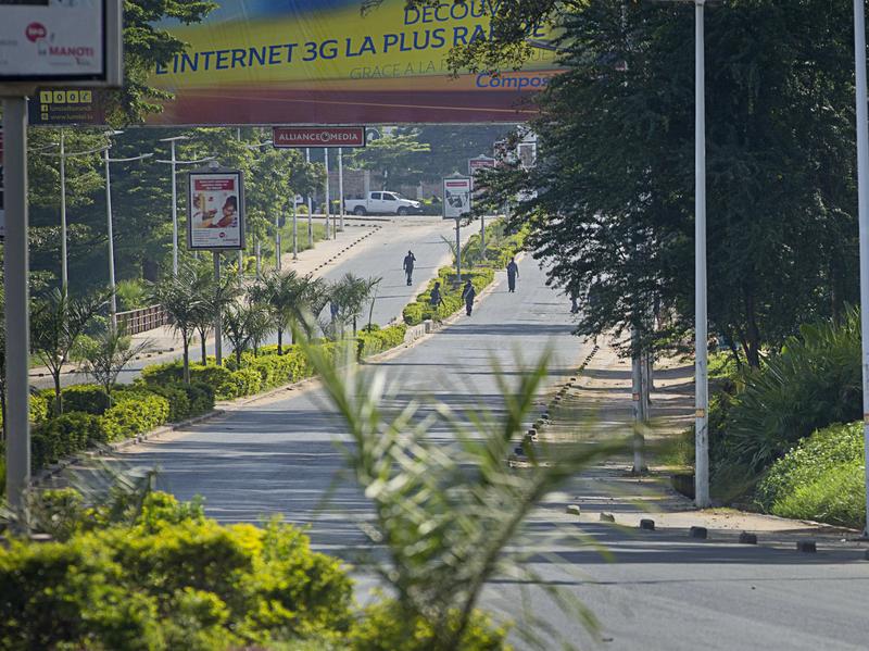 Police forces patrol on a deserted major road in Burundi's capital, Bujumbura, on Thursday following a failed coup.