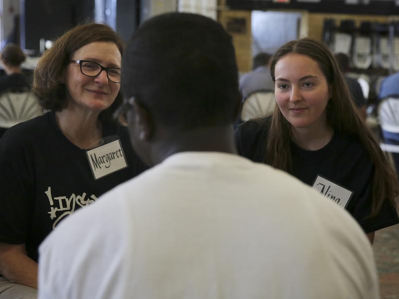 Inmates talk with professors about how to teach classes in the Inside-Out program, where half the students are prisoners and half are traditional college students.