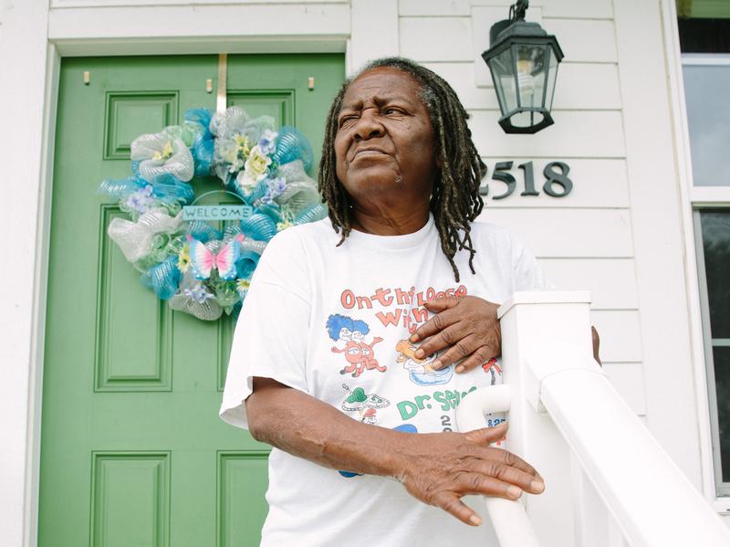 Bobbie Jennings, 69, stands outside her home in the Harmony Oaks housing development in New Orleans. Jennings says that she misses the sense of community of the Magnolia projects, the nickname of the C.J. Peete projects that Harmony Oaks replaced.