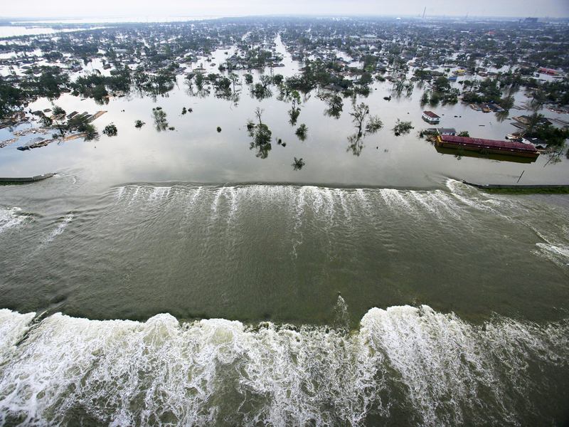 Water spills into New Orleans' Lower Ninth Ward through a failed floodwall along the Industrial Canal on Aug. 30, 2005, a day after Hurricane Katrina tore through the city