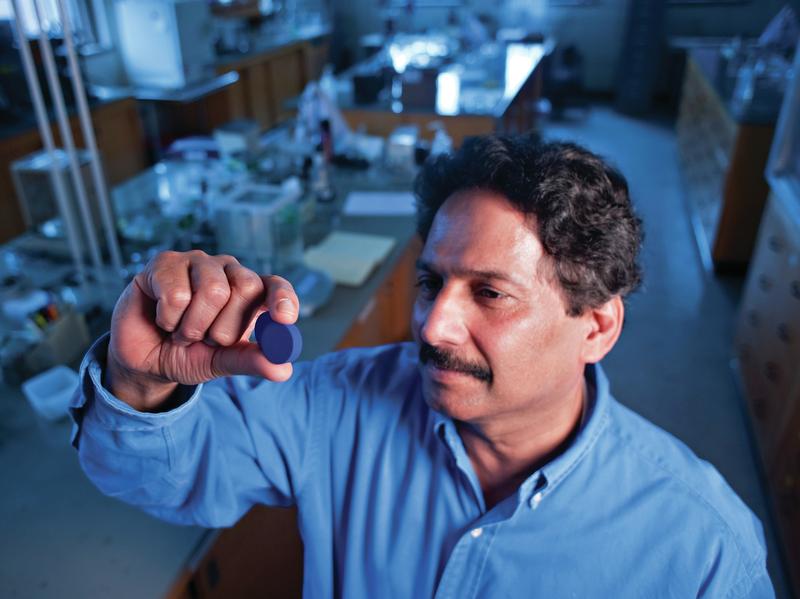 Professor Mas Subramanian looks at the blue pigment that was discovered at his lab in Oregon State University.