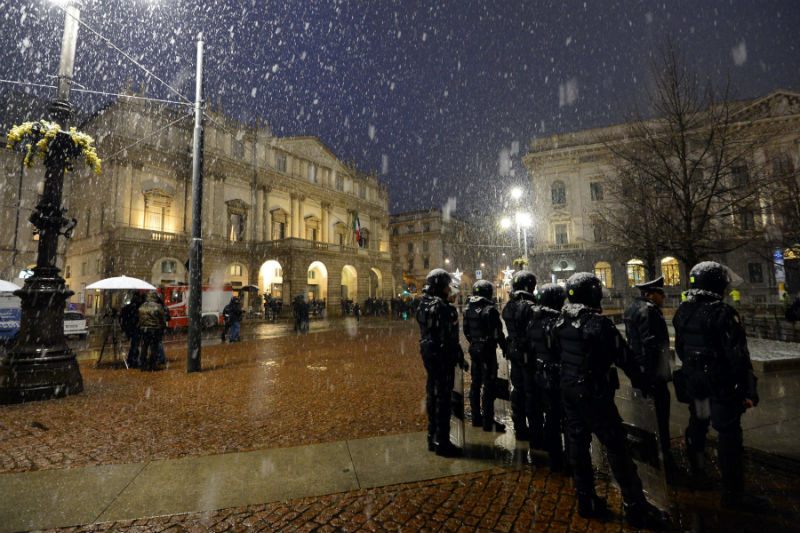 Riot policemen stand as guests arrive for the opening show of La Scala's season on Dec. 7, 2012