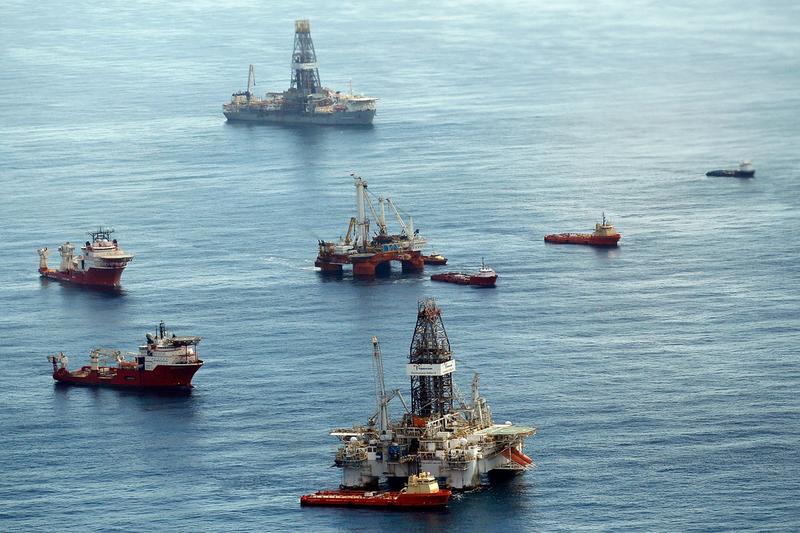 Ships assist in clean up and containment near the source of the BP Deepwater Horizon oil spill July 27, 2010 in the Gulf of Mexico off the coast of Louisiana.