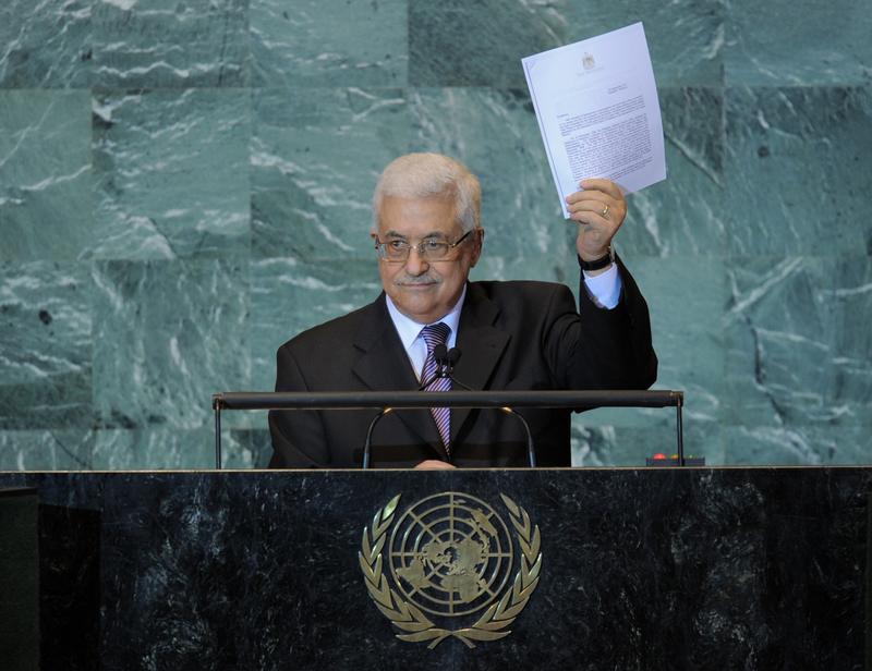 Mahmoud Abbas, President of the Palestinian Authority, holds a copy of the letter requesting Palestinian statehood as he speaks during the United Nations General Assembly September 23, 2011 at UN head