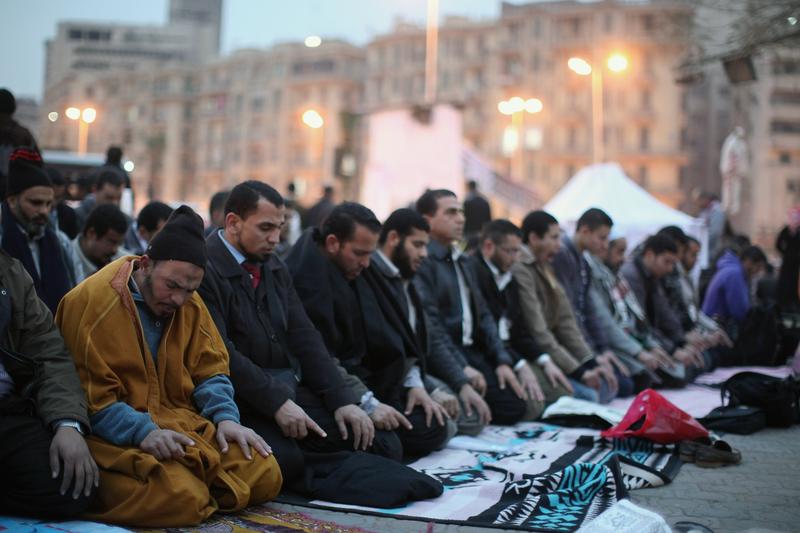 Members of the Muslim Brotherhood hold prayers in Tahir Square ahead of the first anniversary of the revolution on January 24, 2012 in Cairo, Egypt.