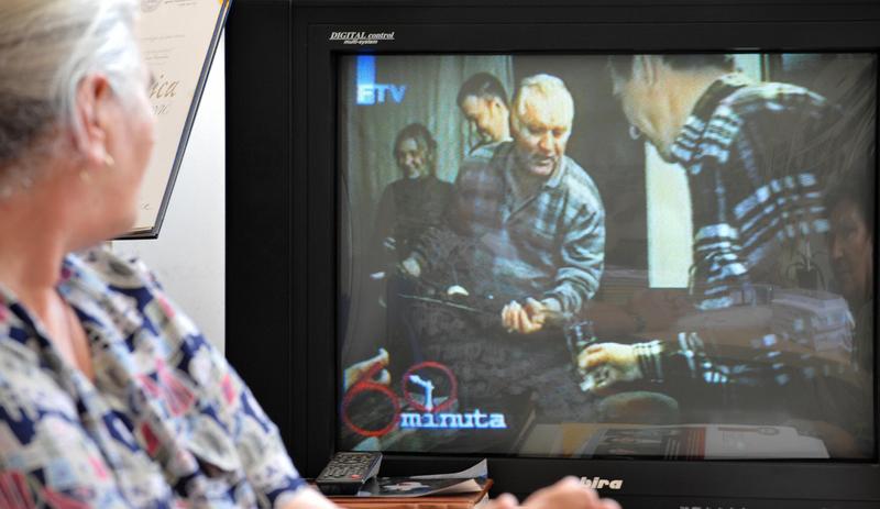 Bosnian Muslim woman, Munira Subasic, survivor of Srebrenica genocide in 1995, watches a video of warcrime fugitive, Ratko Mladic, broadcasted by Bosnian Television, in Sarajevo, on June 1