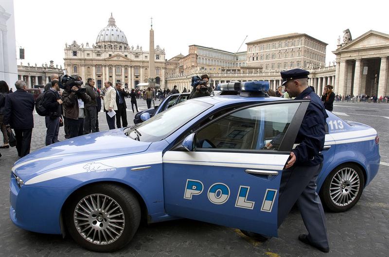 Italian policemen leave St. Peter's Square at the Vatican on March 25, 2010 after removing US citizens taking part in a demonstration against child sexual abuse.