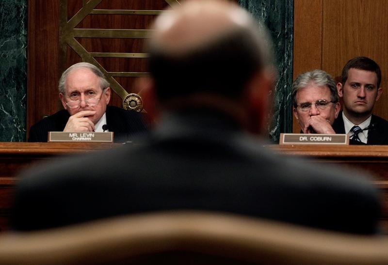 Committee Chair Sen. Carl Levin (D-MI) and ranking member Sen. Tom Coburn (R-OK) listen to testimony from Lloyd Blankfein, chairman and  CEO of The Goldman Sachs Group, on April 27, 2010