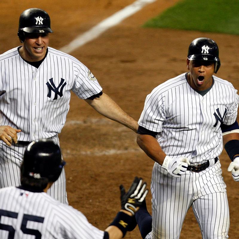 Alex Rodriguez celebrates with Mark Teixeira after beating the Twins in Game 2