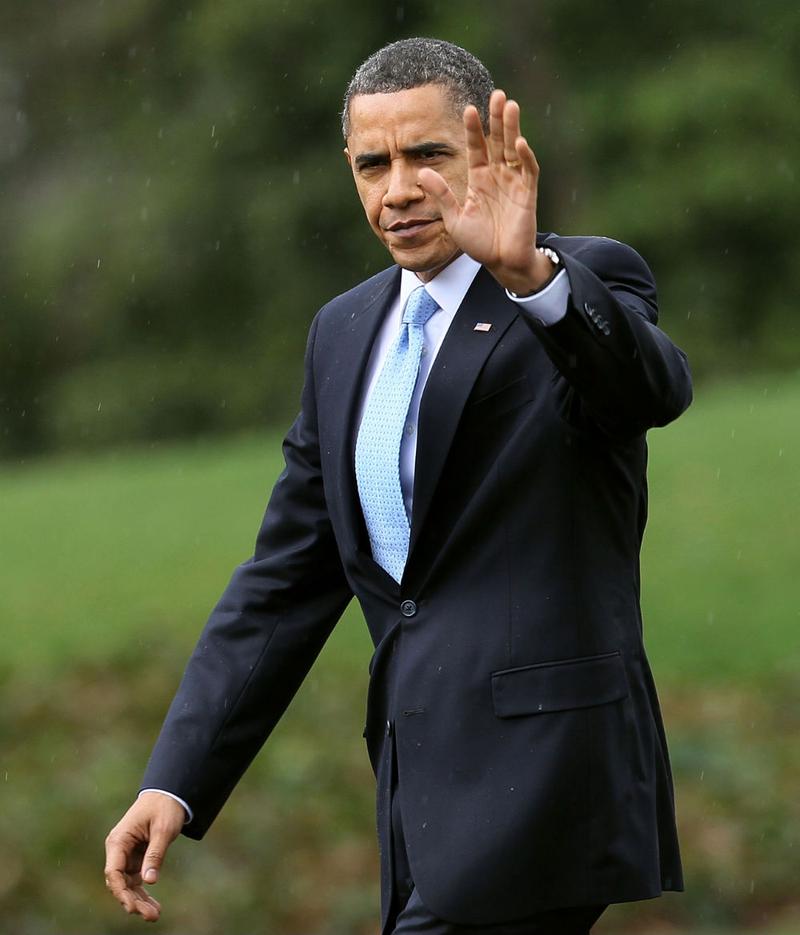 U.S. President Barack Obama waves as he walks towards Marine One while departing the White House for Strongsville, Ohio, where he is scheduled to speak about health care legislation.